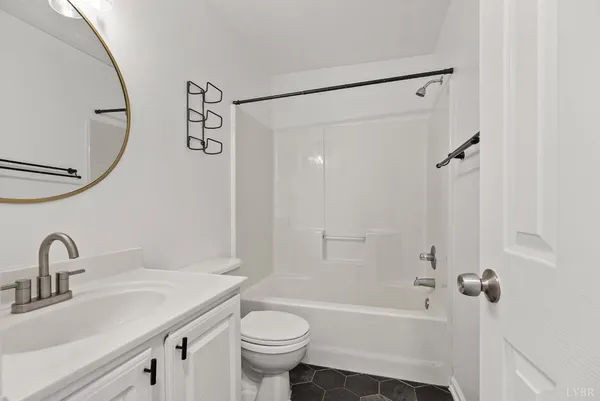 a bathroom with a sink a toilet and a bathtub