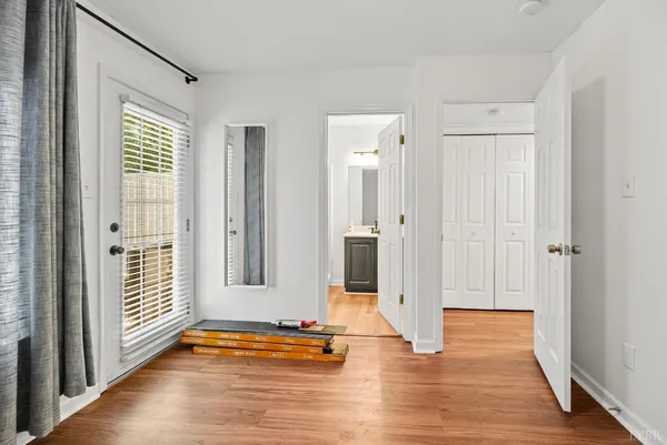 a view of a entryway door with wooden floor