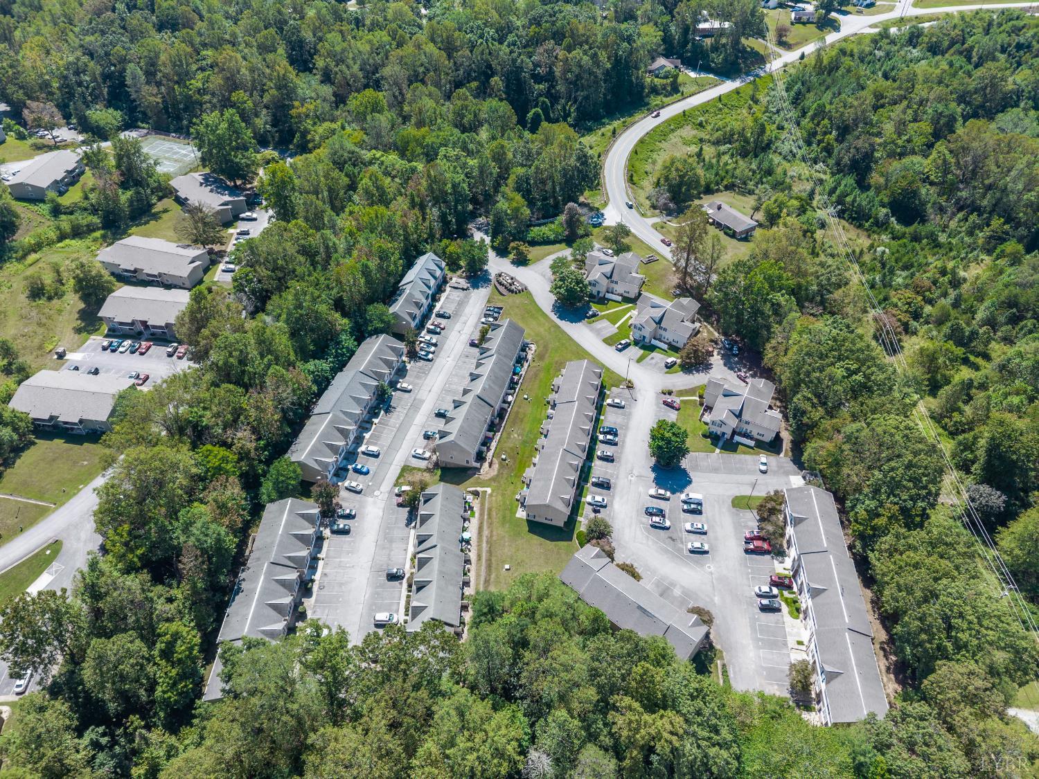 300 McConville Road, Unit 63 Lynchburg, VA 24502 - Photo 33 of 37 an aerial view of a house with a yard and garden