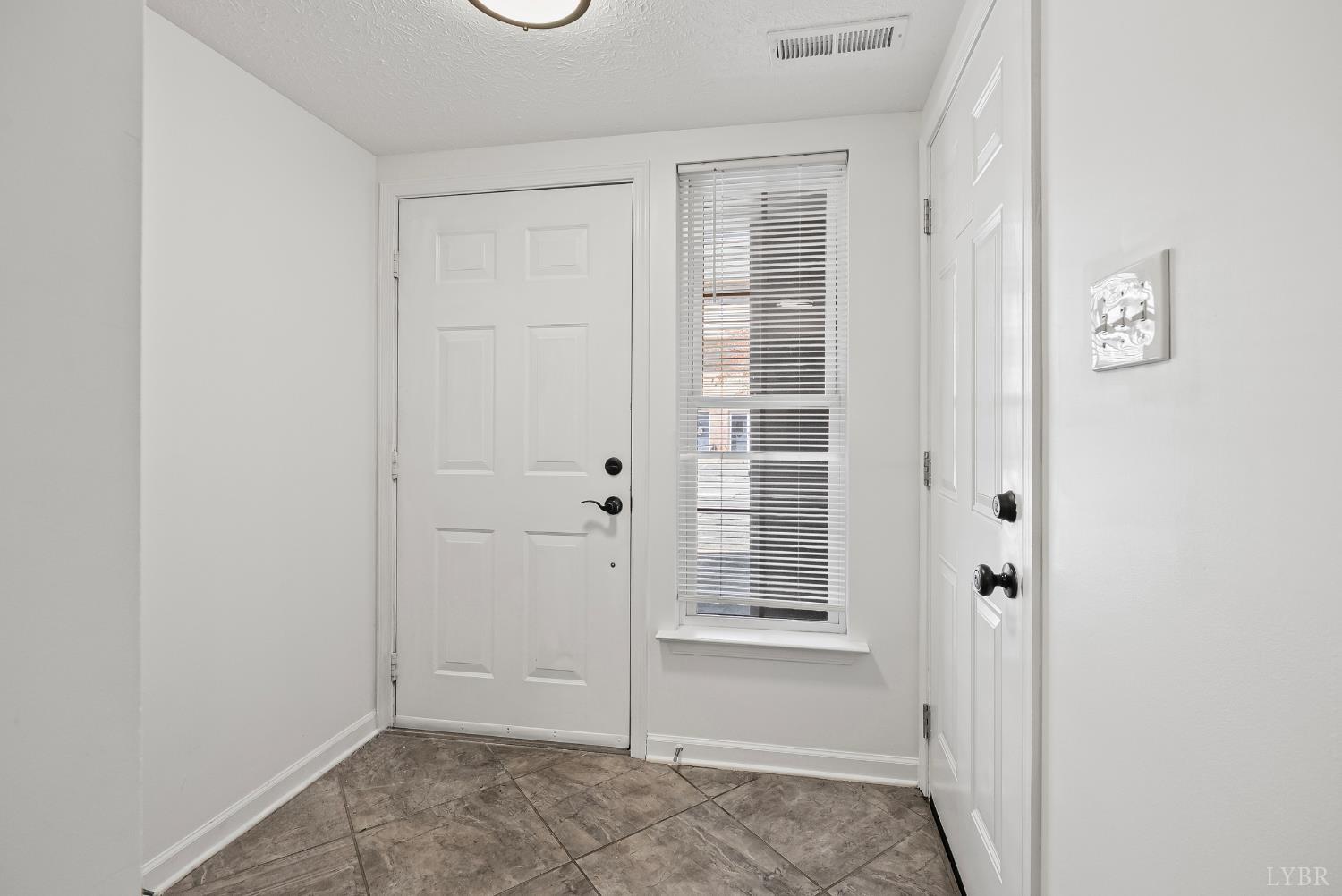 300 McConville Road, Unit 63 Lynchburg, VA 24502 - Photo 5 of 37 an empty room with windows