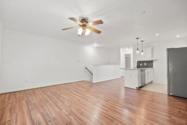 a view of kitchen with cabinets and wooden floor