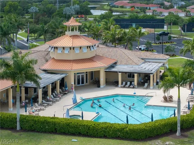 an aerial view of a house with a lake view