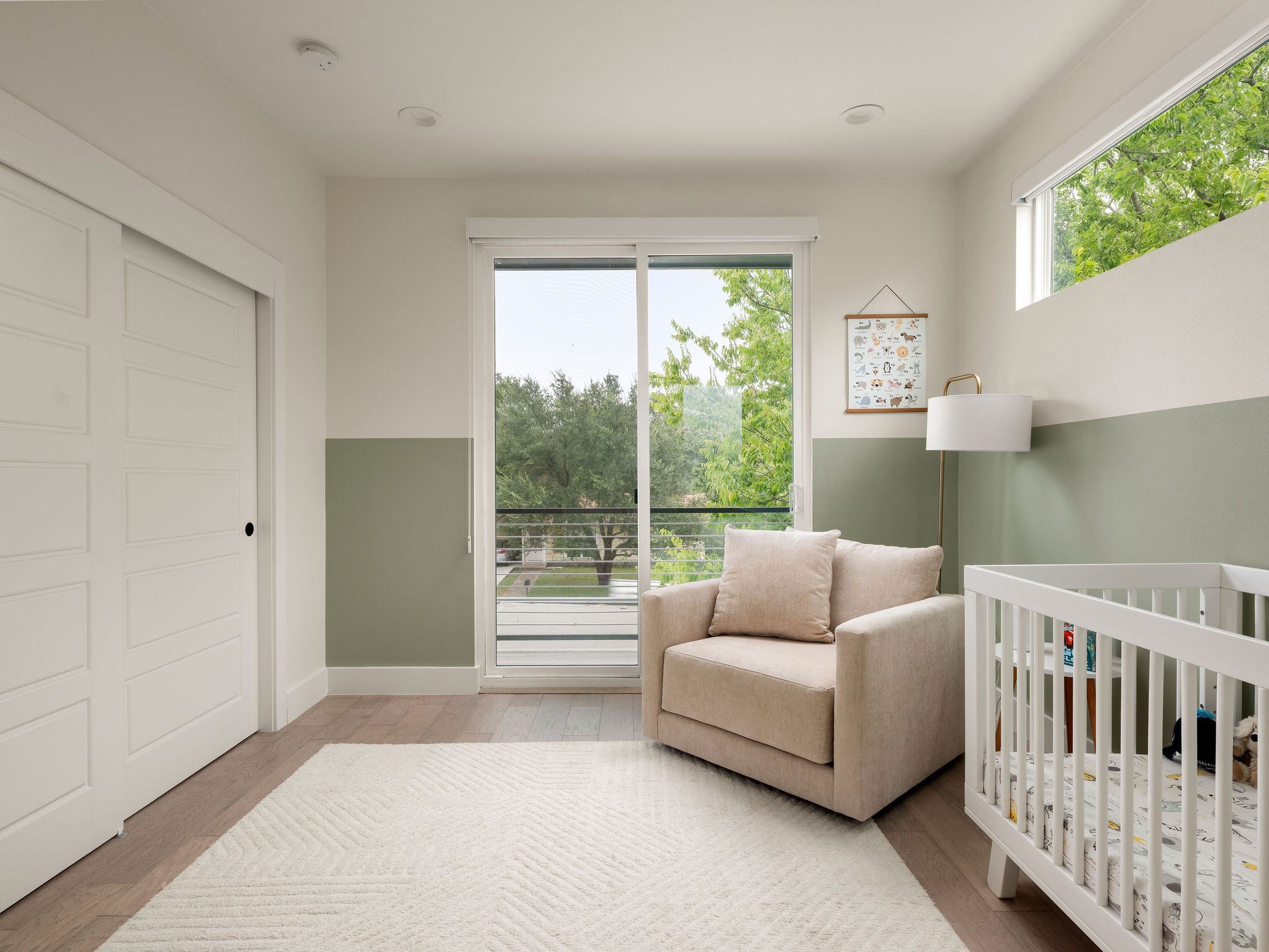 3710 Manorwood Road Austin, TX 78723 - Photo 27 of 40 Hardwood flooring and clean lines define this serene bedroom space, illuminated by natural light.