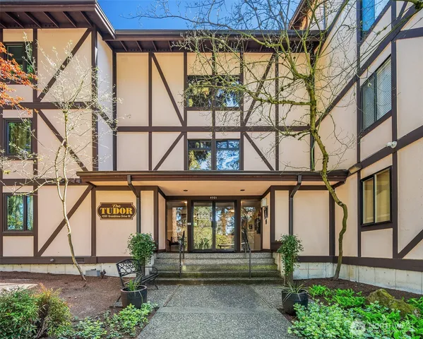 a front view of a building with glass windows and door