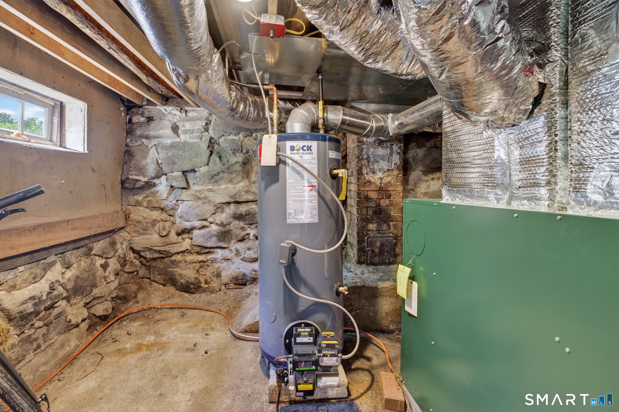 79 River Street Deep River, CT 06417 - Photo 34 of 40 a room with water heater and wooden walls
