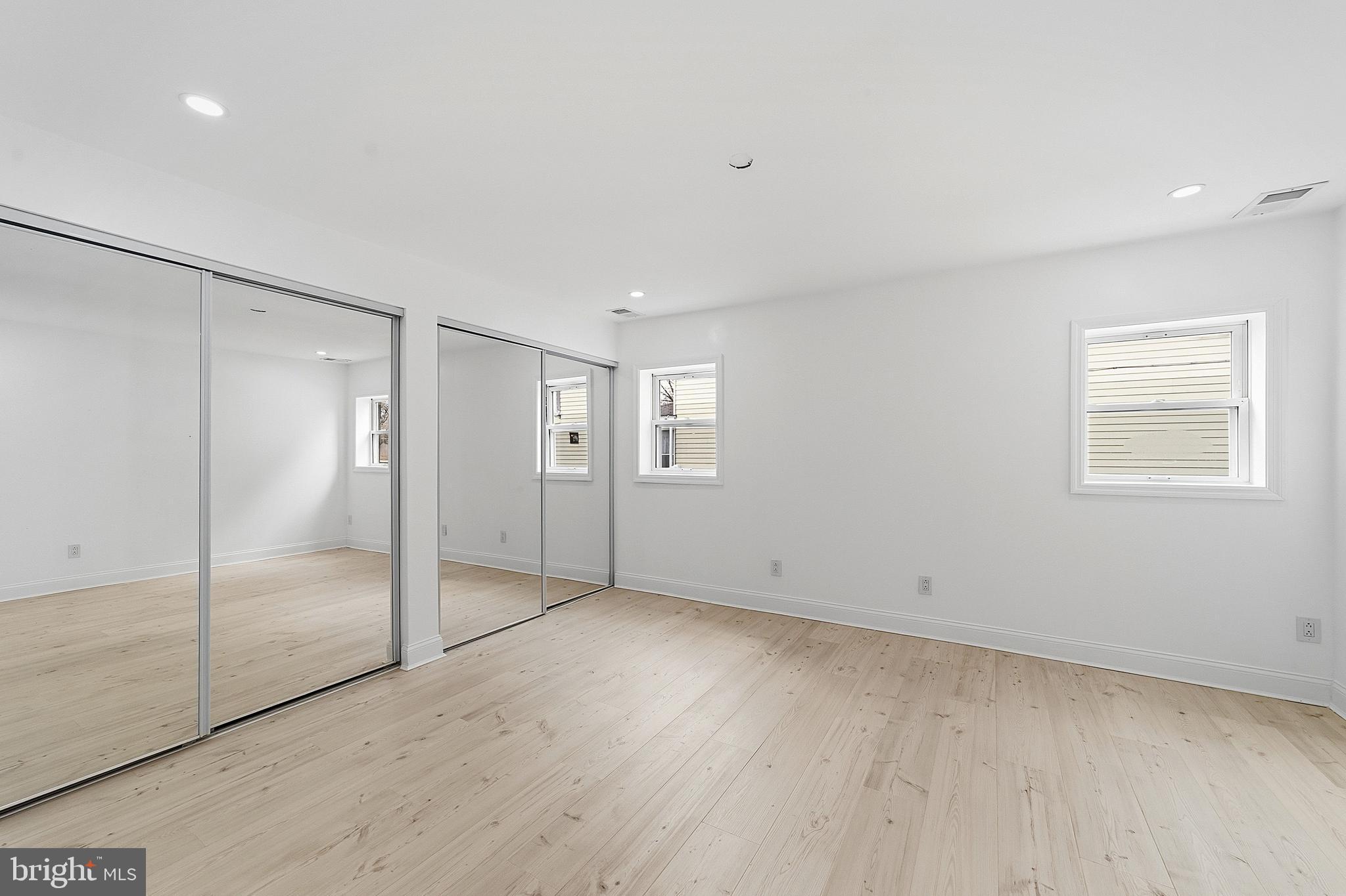 523 Front Street Palmyra, NJ 08065 - Photo 14 of 30 a view of an empty room with wooden floor and a bathroom