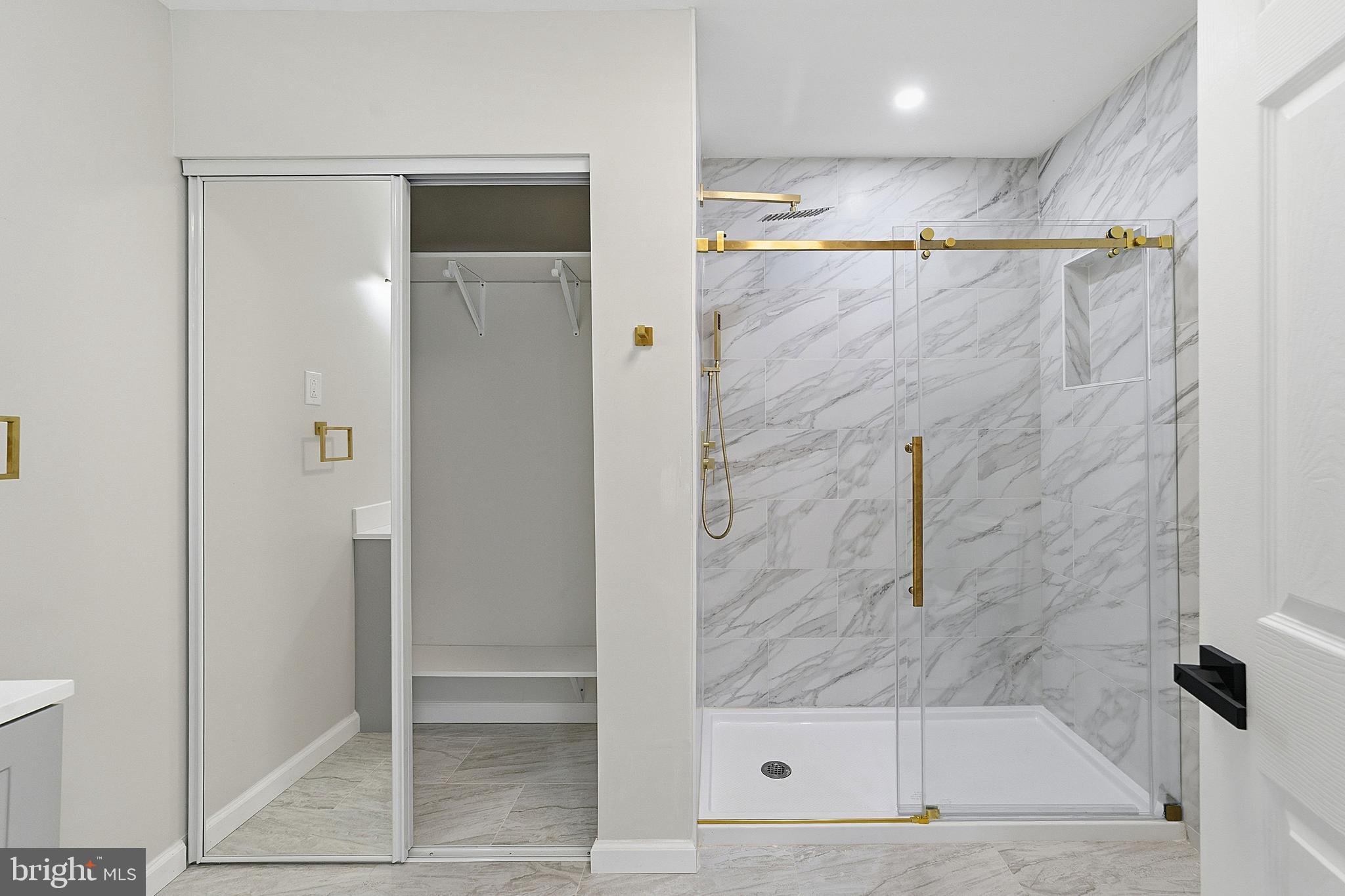 523 Front Street Palmyra, NJ 08065 - Photo 15 of 30 a bathroom with a glass shower door