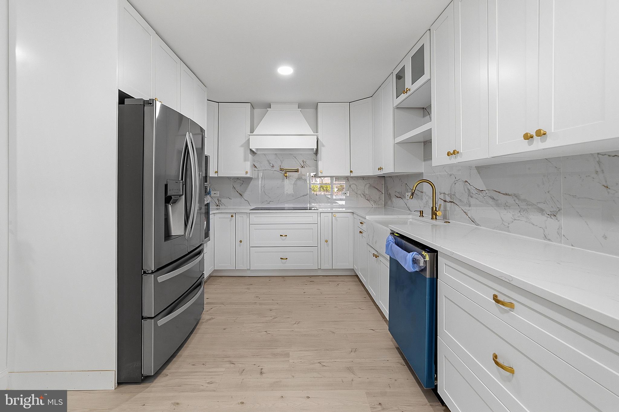 523 Front Street Palmyra, NJ 08065 - Photo 20 of 30 a kitchen with stainless steel appliances a refrigerator sink and cabinets
