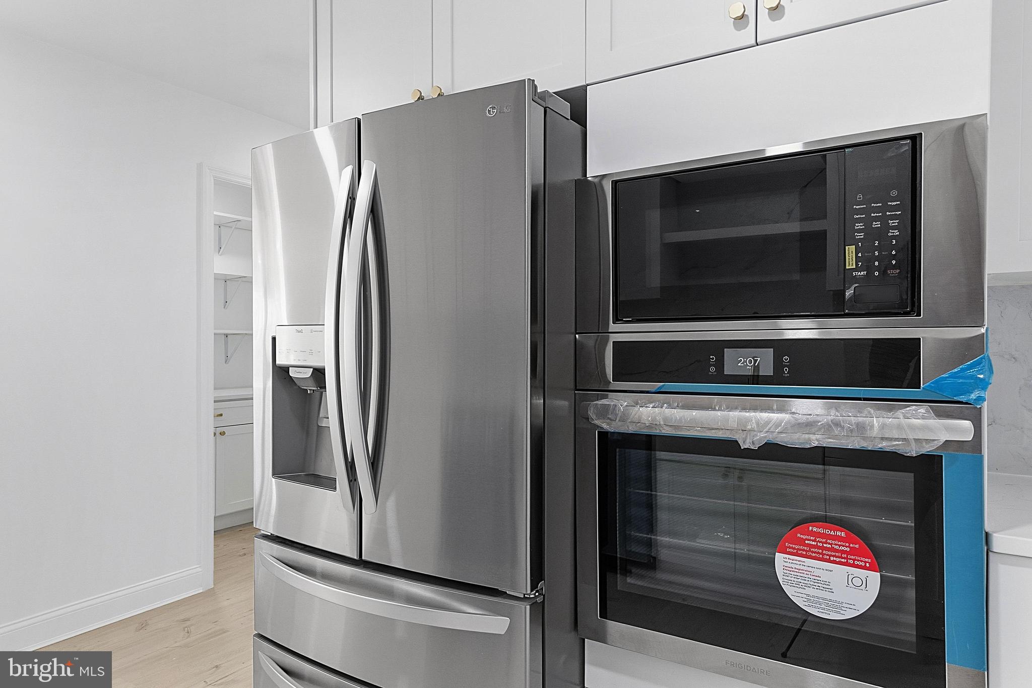 523 Front Street Palmyra, NJ 08065 - Photo 23 of 30 a kitchen with a refrigerator and a stove