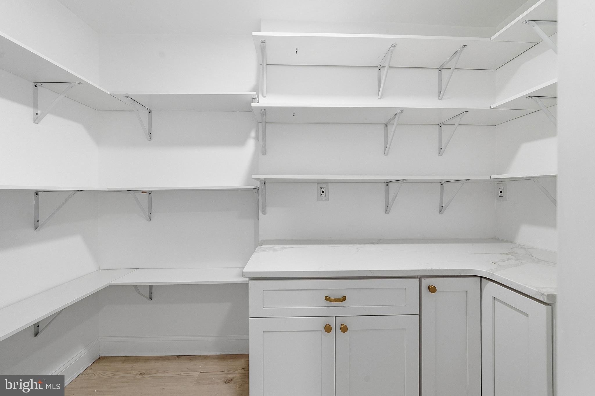 523 Front Street Palmyra, NJ 08065 - Photo 24 of 30 a view of cabinets and utility room with racks on the wall