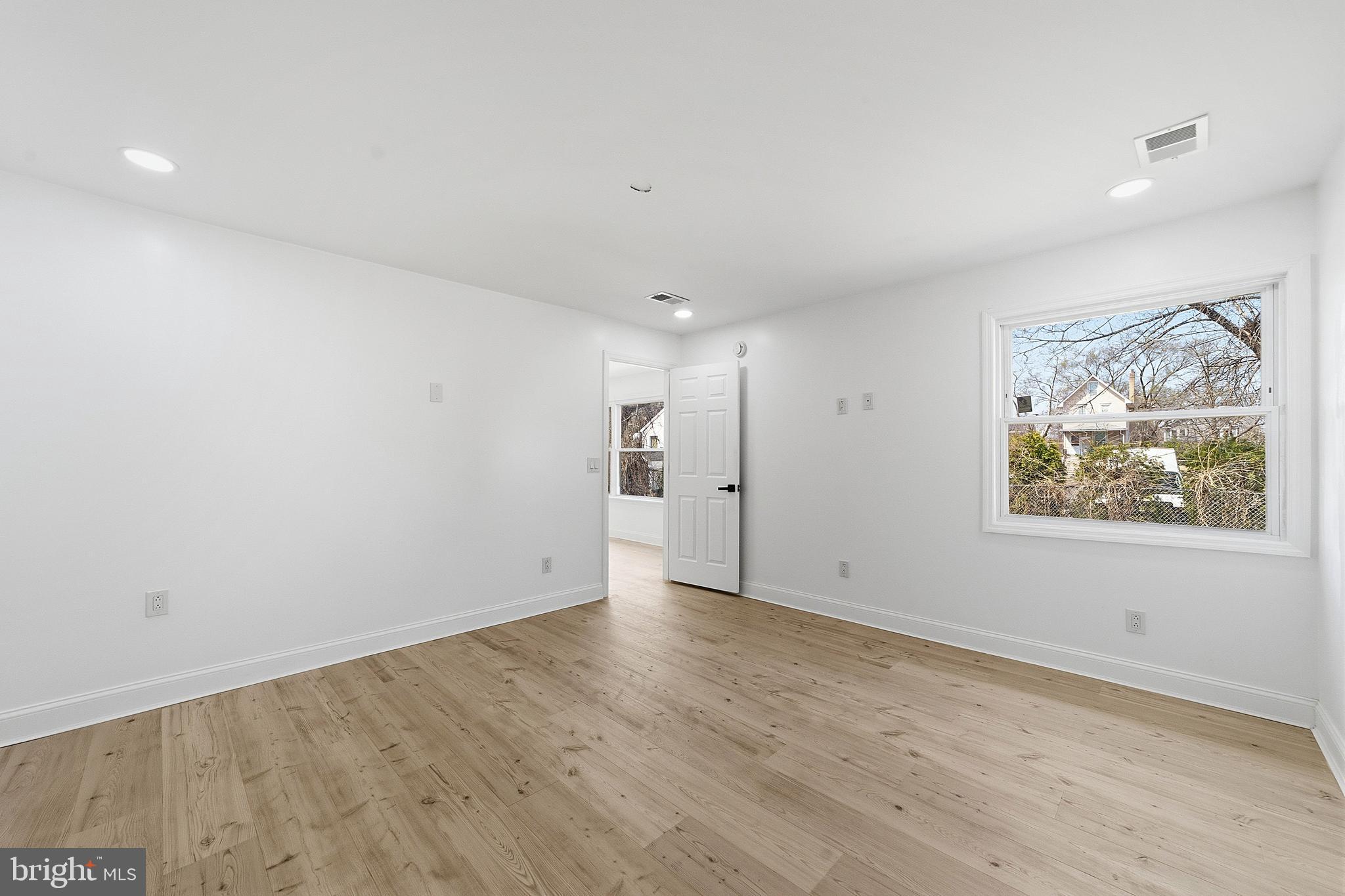 523 Front Street Palmyra, NJ 08065 - Photo 4 of 30 wooden floor in an empty room with a window