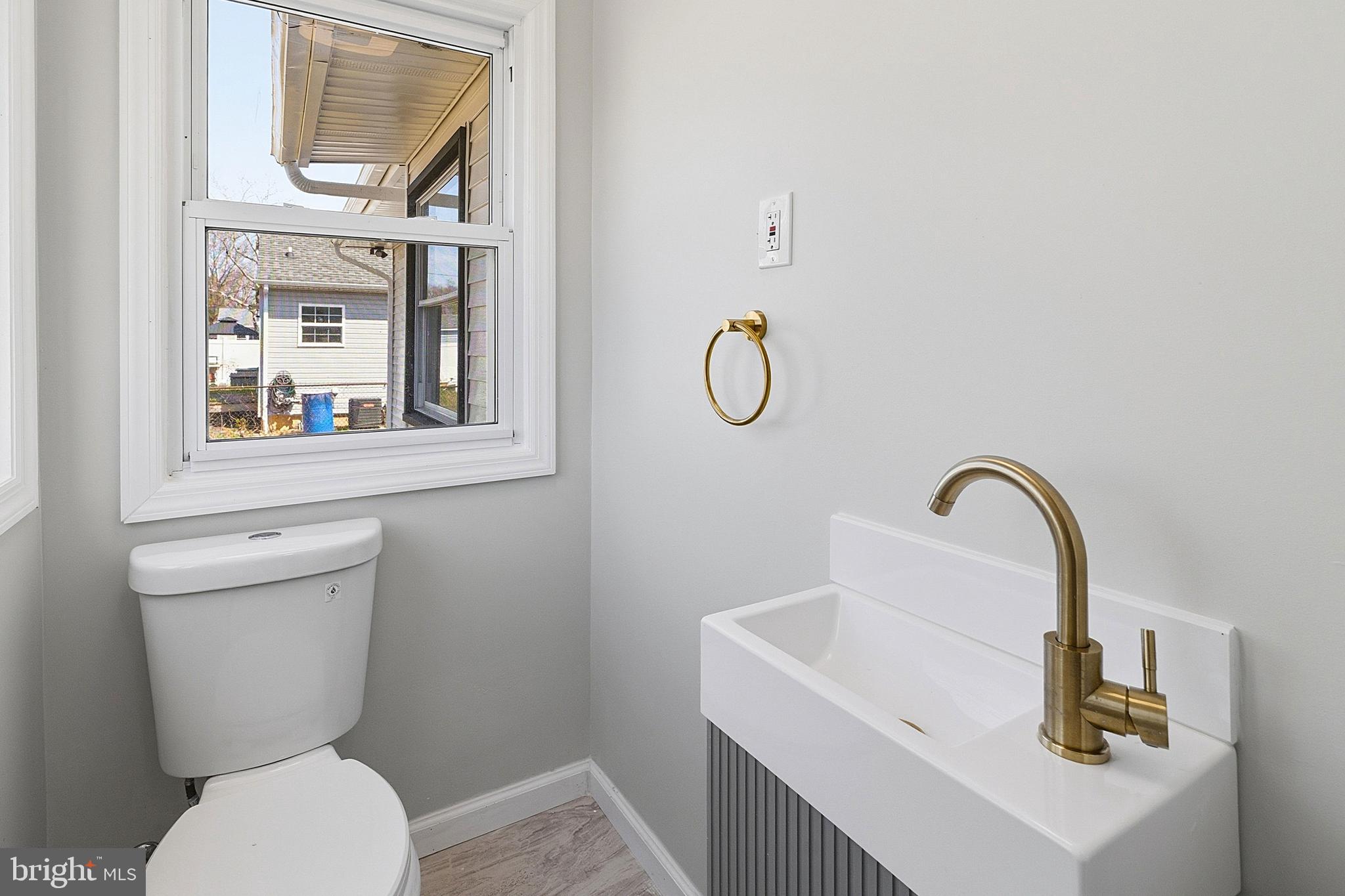 523 Front Street Palmyra, NJ 08065 - Photo 8 of 30 a bathroom with a toilet and a sink