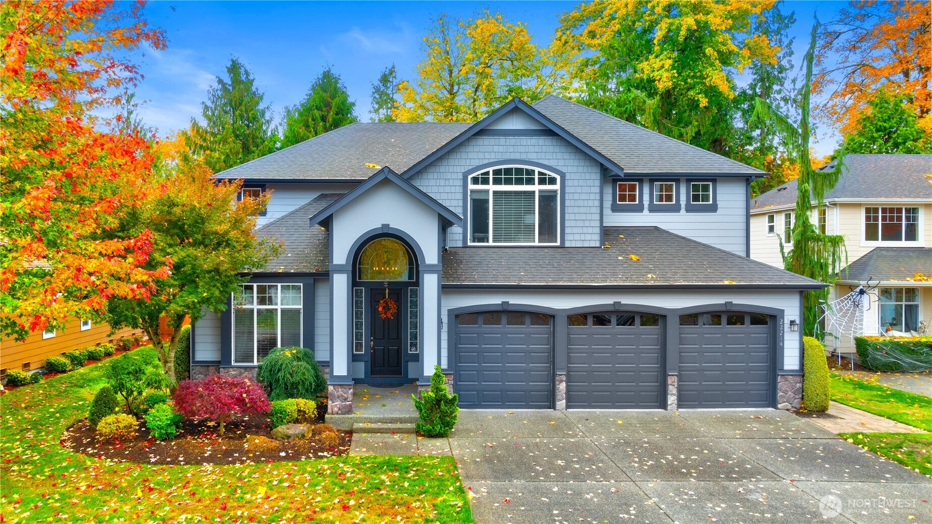 a front view of a house with garden