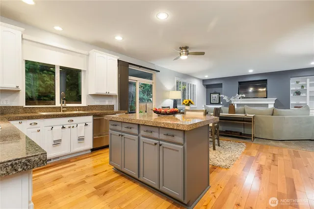a kitchen with sink cabinets and window