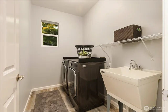 a front view of a house with a garden and patio