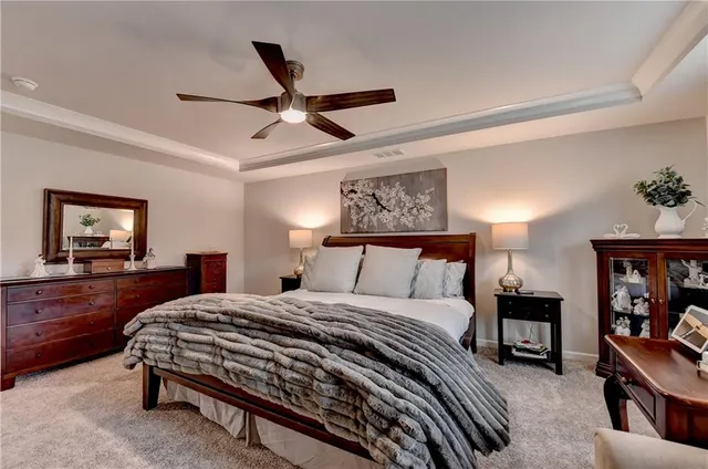 a bedroom with a bed and dresser