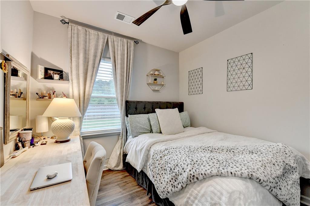 3153 Lowell Road Bethlehem, GA 30620 - Photo 17 of 25 a large bed sitting in a bedroom next to a window