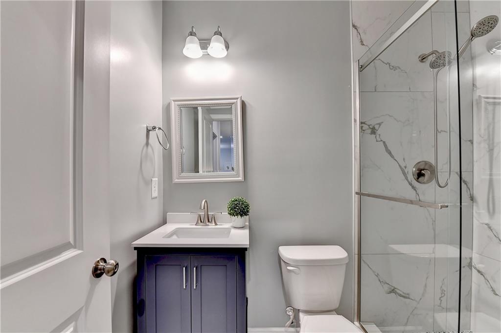 3153 Lowell Road Bethlehem, GA 30620 - Photo 18 of 25 a bathroom with a sink toilet and shower