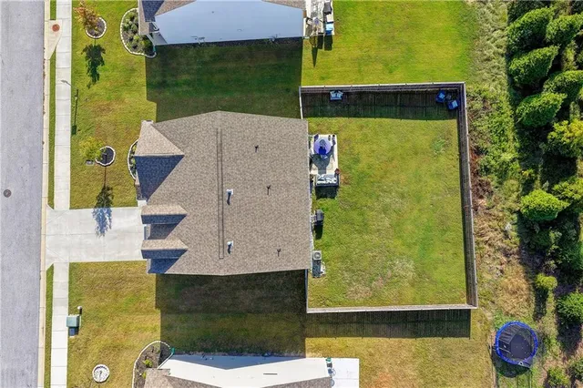 a aerial view of a house with a yard