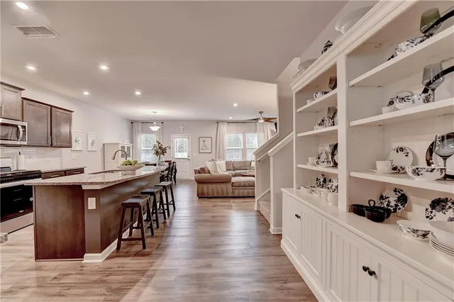 a kitchen with stainless steel appliances lots of counter top space and cabinets