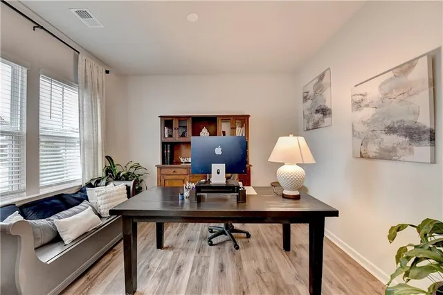 a view of a workspace with furniture