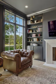 a spacious bedroom with a bed and a window