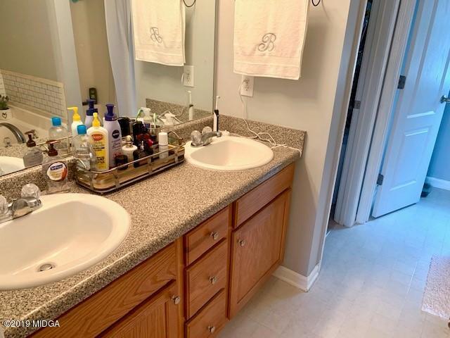 3315 Trotters Ridge Trail Gray, GA 31032 - Photo 16 of 33 a bathroom with sink and mirror