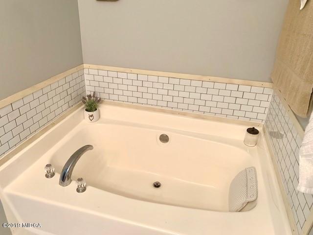 3315 Trotters Ridge Trail Gray, GA 31032 - Photo 17 of 33 a bathroom with a bathtub