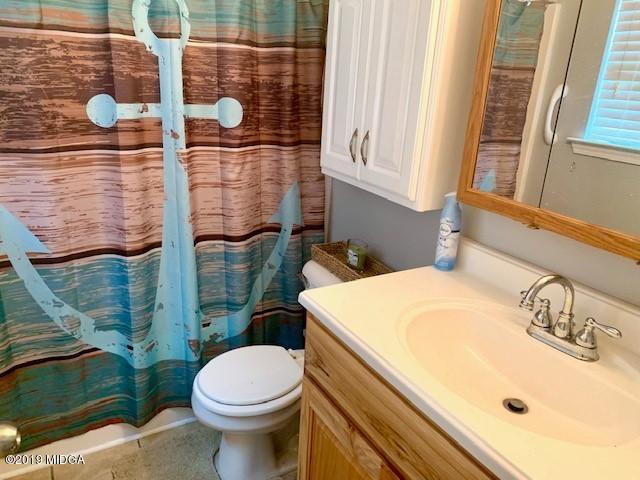 3315 Trotters Ridge Trail Gray, GA 31032 - Photo 23 of 33 a bathroom with a sink and a toilet