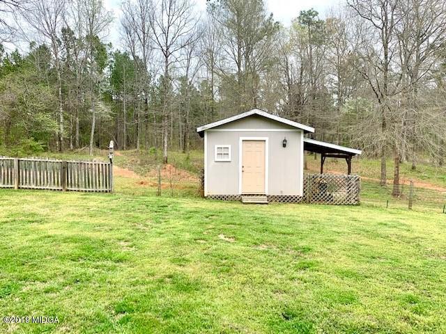 3315 Trotters Ridge Trail Gray, GA 31032 - Photo 27 of 33 a front view of a house with a yard and trees