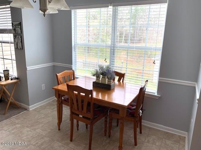 3315 Trotters Ridge Trail Gray, GA 31032 - Photo 5 of 33 a view of a dining room with furniture and window