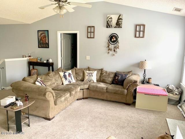 3315 Trotters Ridge Trail Gray, GA 31032 - Photo 6 of 33 a living room with furniture and a table