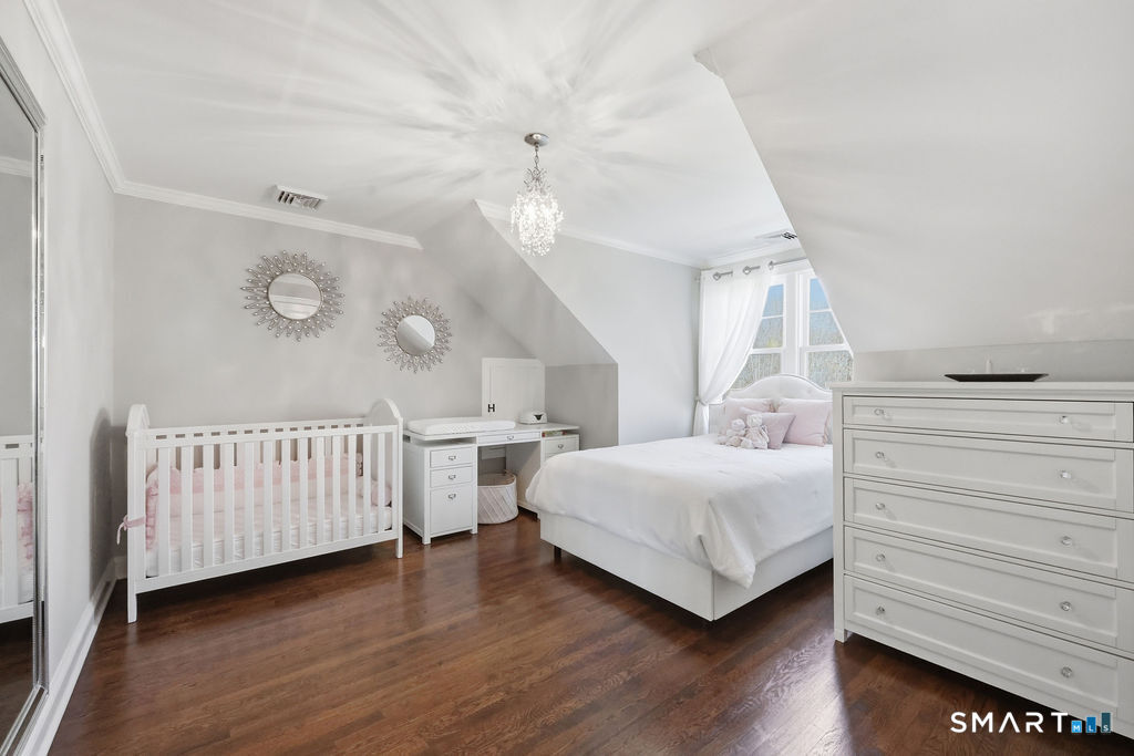 21 Split Rock Road Newtown, CT 06470 - Photo 22 of 40 a bedroom with a bed and a window