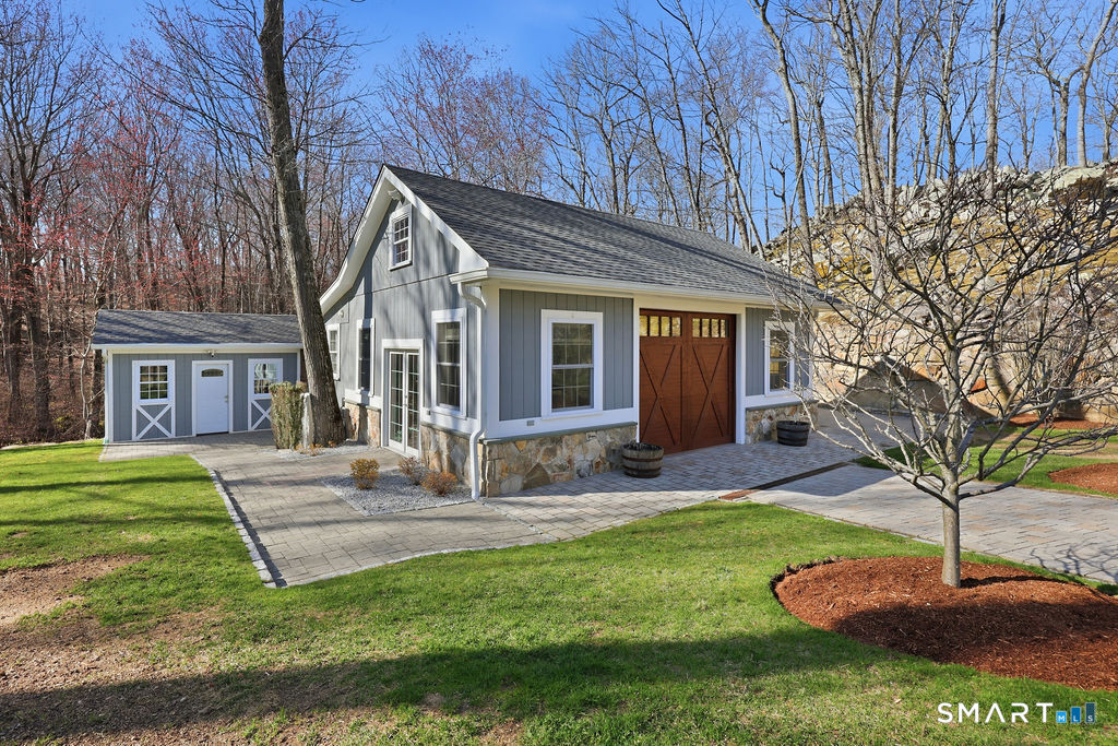 21 Split Rock Road Newtown, CT 06470 - Photo 29 of 40 a front view of a house with a yard