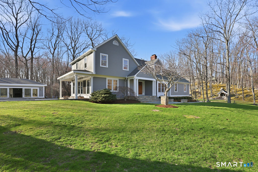 21 Split Rock Road Newtown, CT 06470 - Photo 31 of 40 a front view of a house with a garden