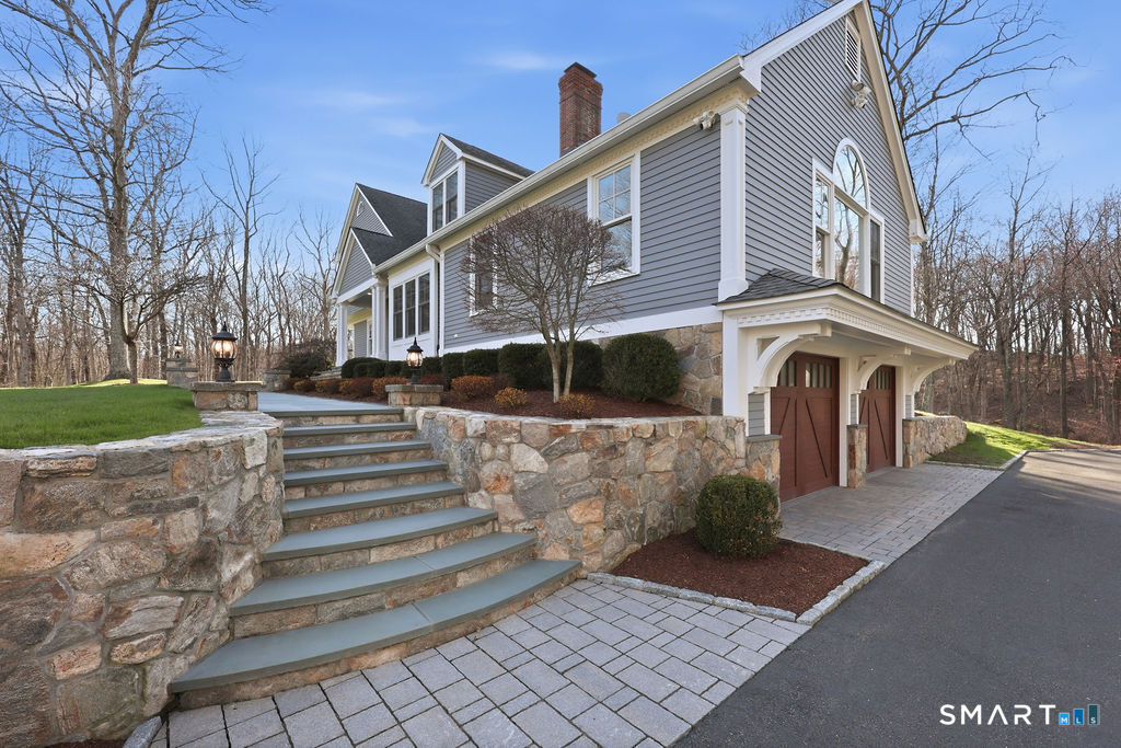 21 Split Rock Road Newtown, CT 06470 - Photo 33 of 40 a front view of a house with a yard