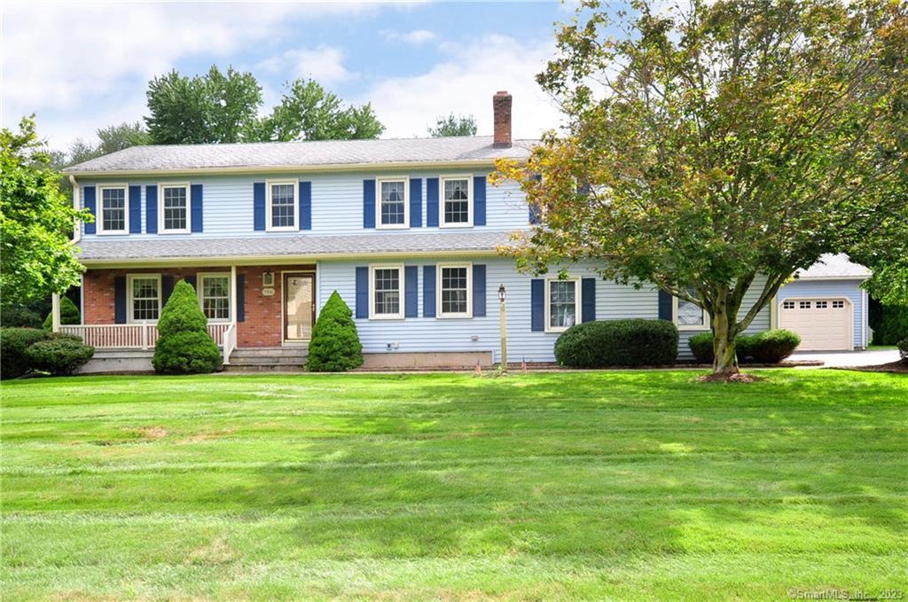 156 Carriage Way Windsor, CT 06095 - Photo 1 of 1 a view of a house with a big yard and large trees