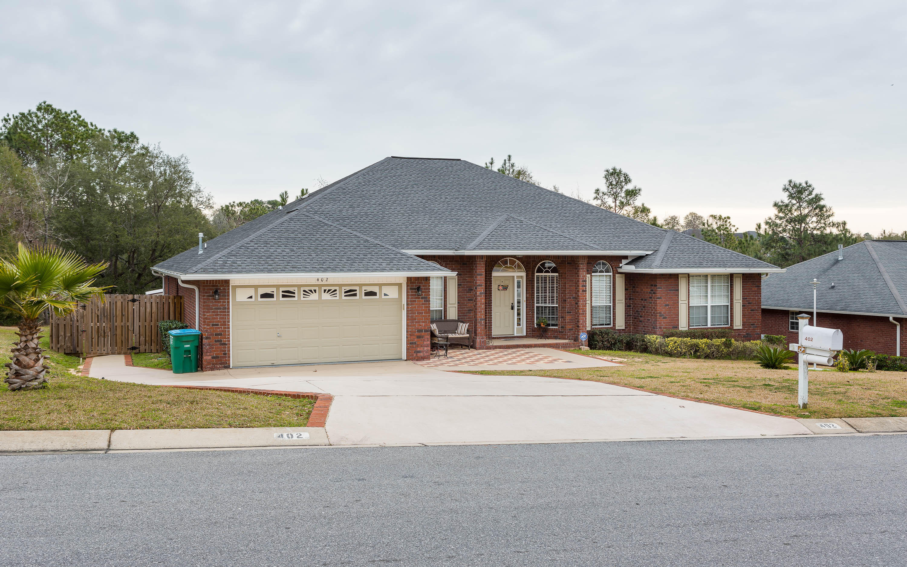402 Swift Fox Run Crestview, FL 32536 - Photo 1 of 47 a front view of a house with a yard and garage