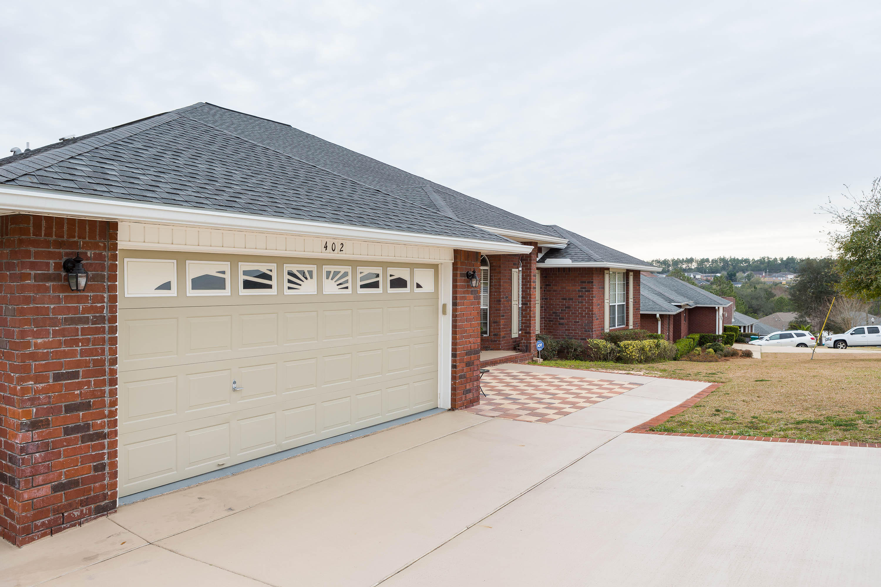 402 Swift Fox Run Crestview, FL 32536 - Photo 2 of 47 a front view of a house with a yard