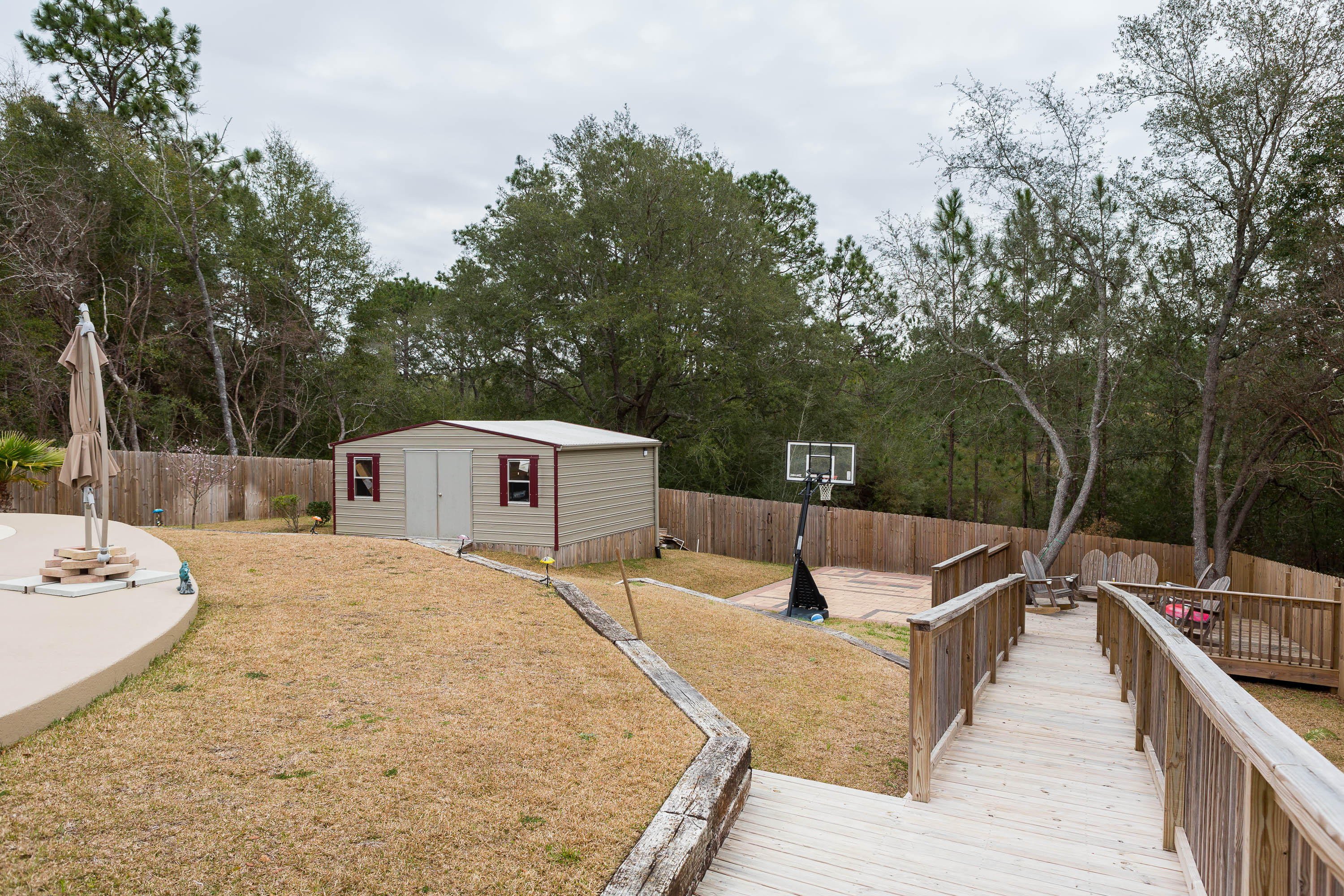 402 Swift Fox Run Crestview, FL 32536 - Photo 11 of 47 swimming pool view with a seating space