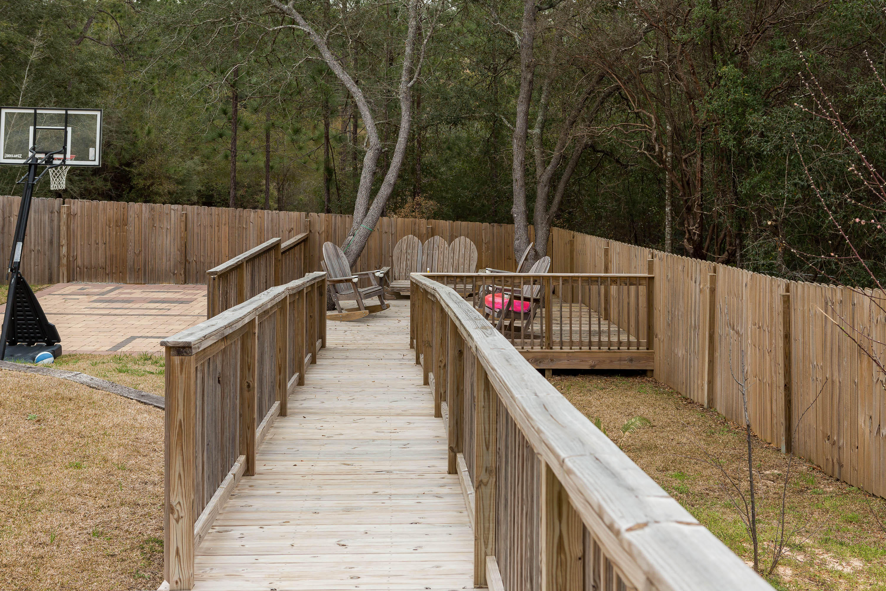 402 Swift Fox Run Crestview, FL 32536 - Photo 12 of 47 a balcony with wooden floor
