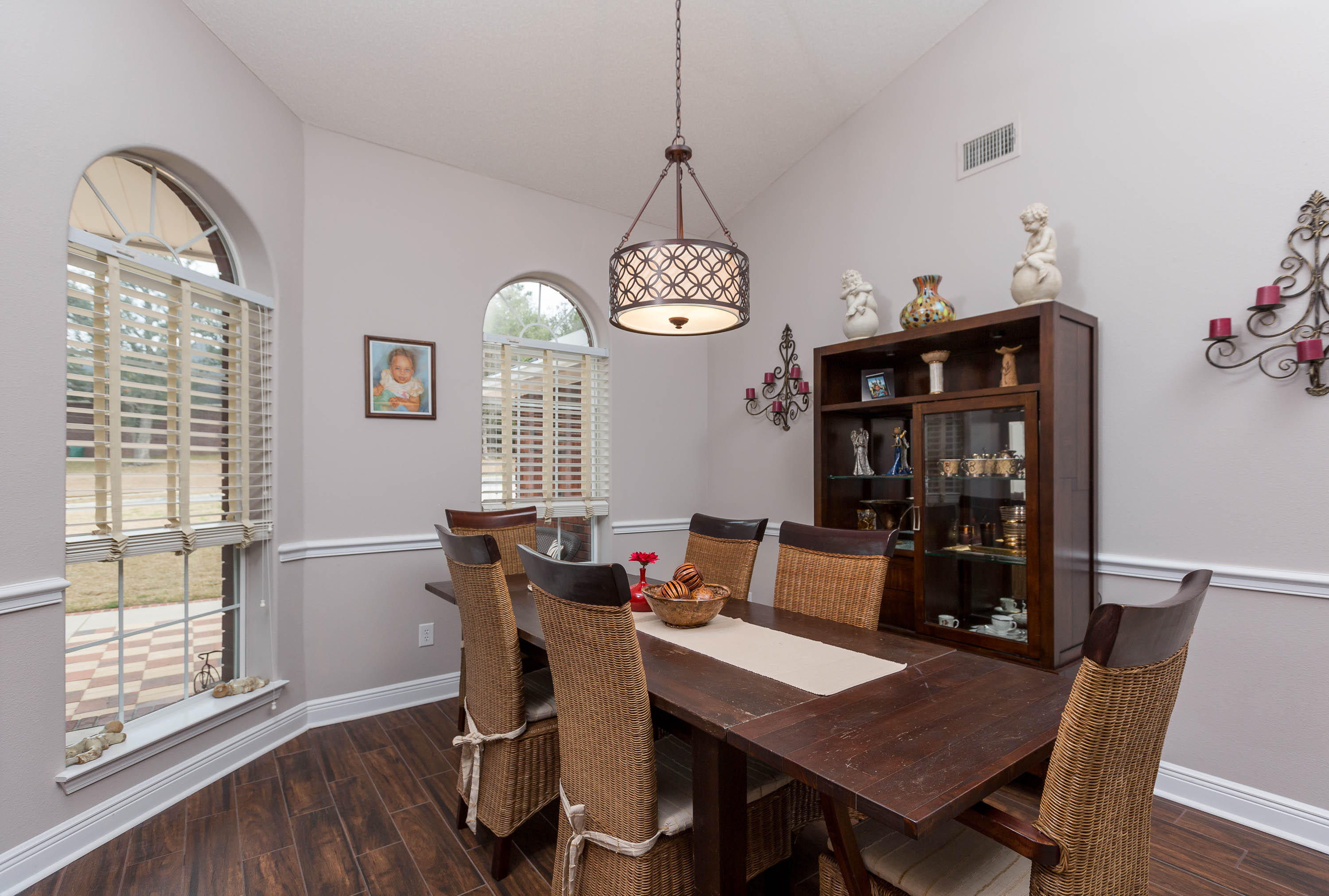 402 Swift Fox Run Crestview, FL 32536 - Photo 18 of 47 a view of a dining room with furniture window and wooden floor