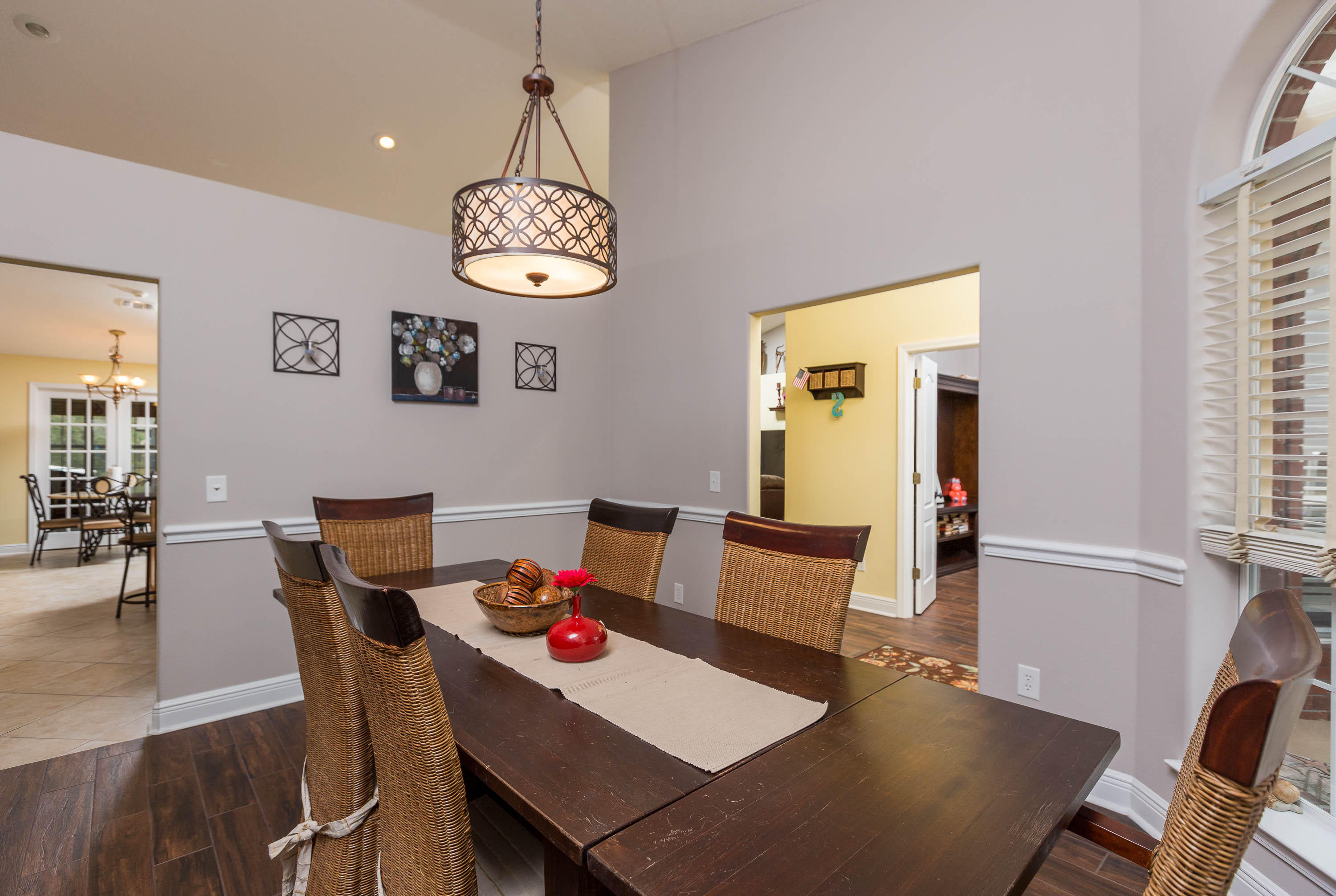 402 Swift Fox Run Crestview, FL 32536 - Photo 19 of 47 a view of a dining room with furniture wooden floor and a chandelier