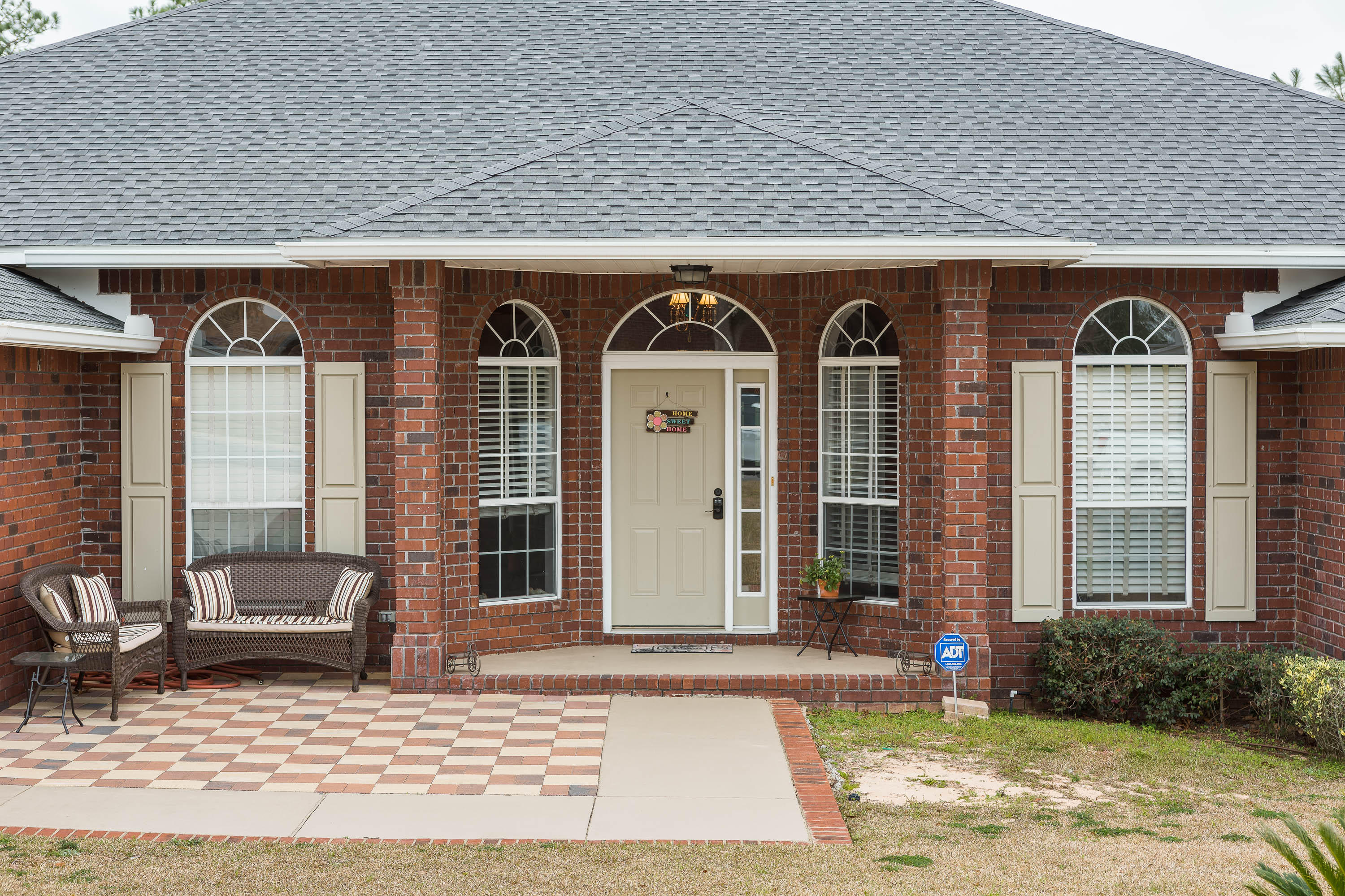 402 Swift Fox Run Crestview, FL 32536 - Photo 3 of 47 a front view of a house with garden