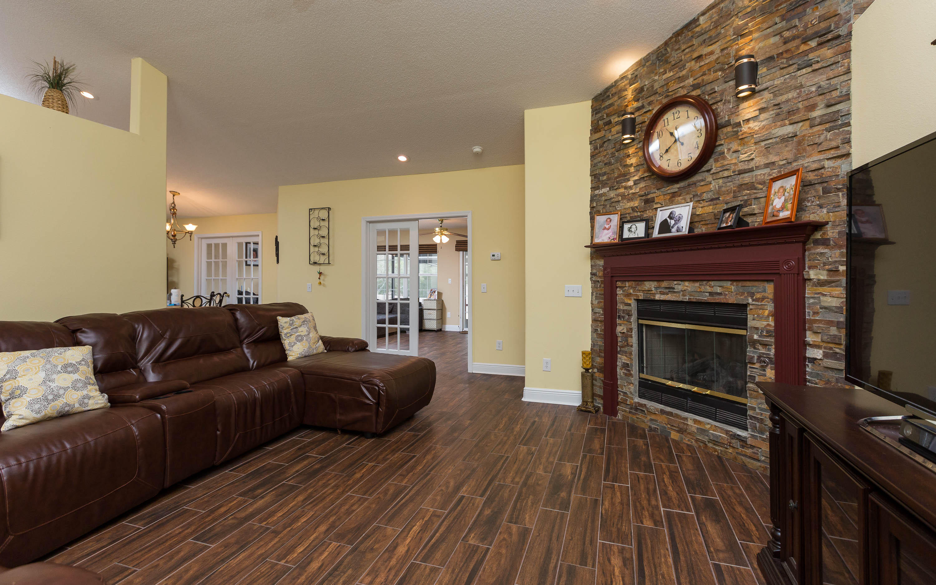 402 Swift Fox Run Crestview, FL 32536 - Photo 22 of 47 a living room with furniture and a fireplace