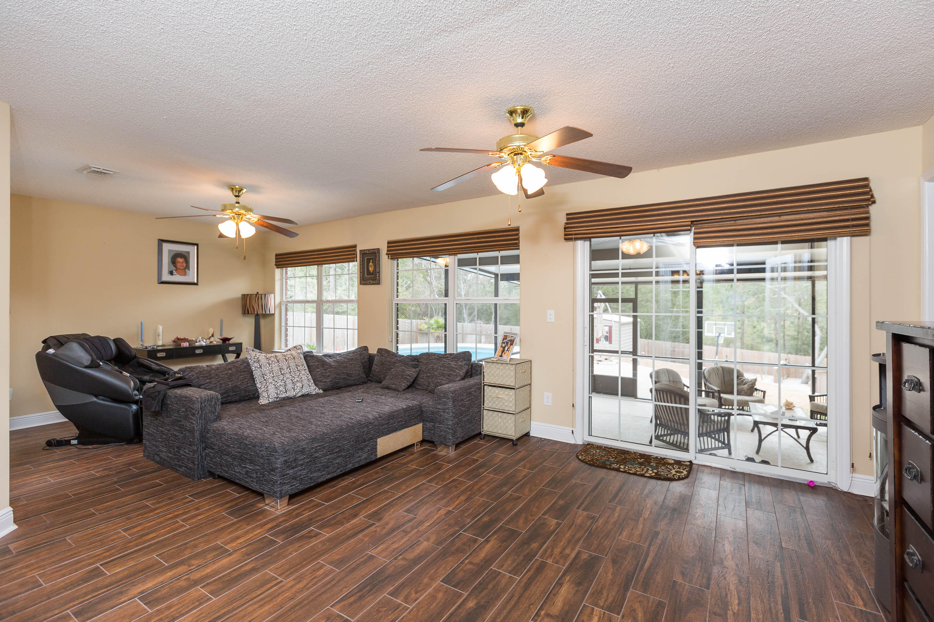 402 Swift Fox Run Crestview, FL 32536 - Photo 25 of 47 a living room with furniture and a large window