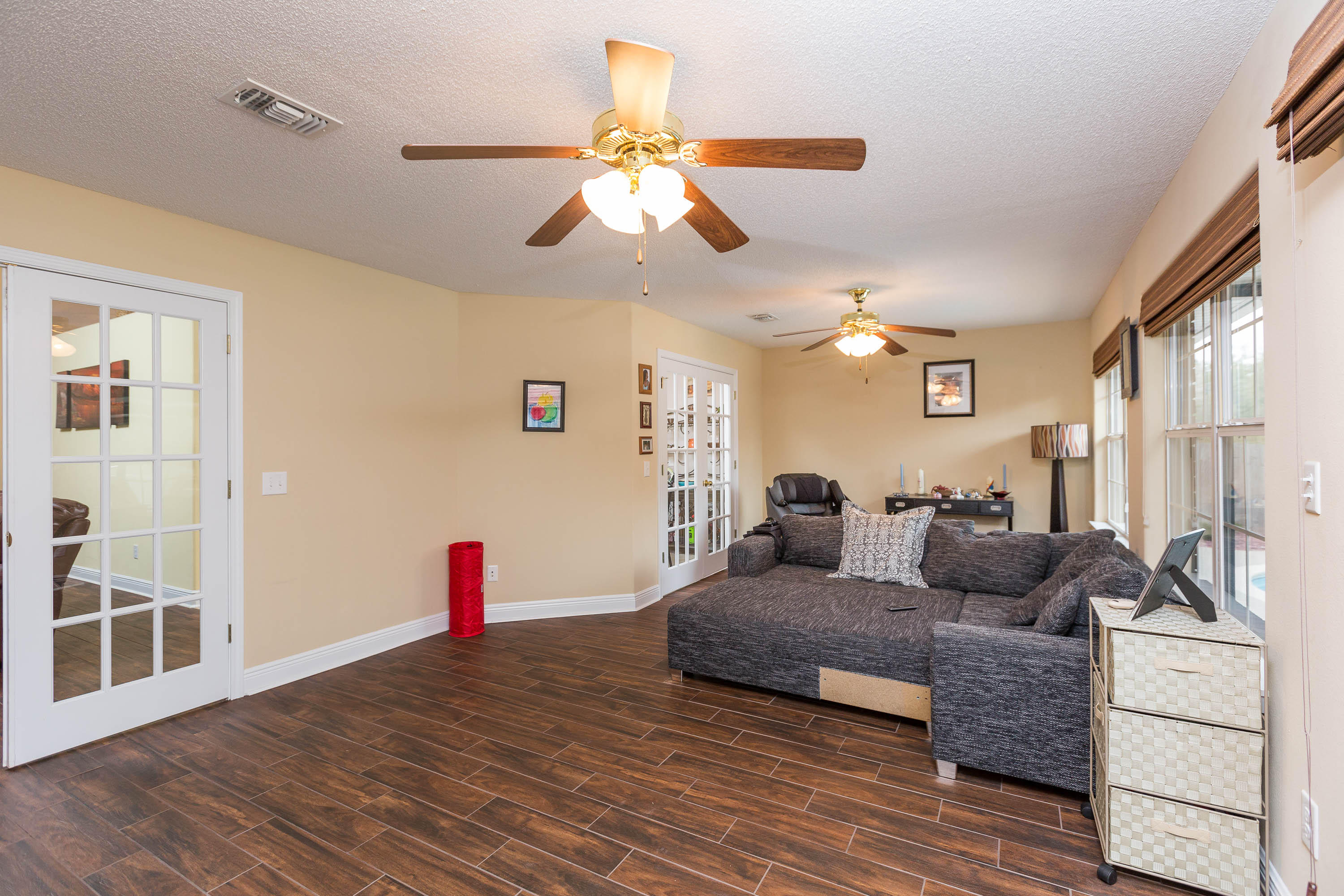 402 Swift Fox Run Crestview, FL 32536 - Photo 26 of 47 a living room with furniture and a wooden floor
