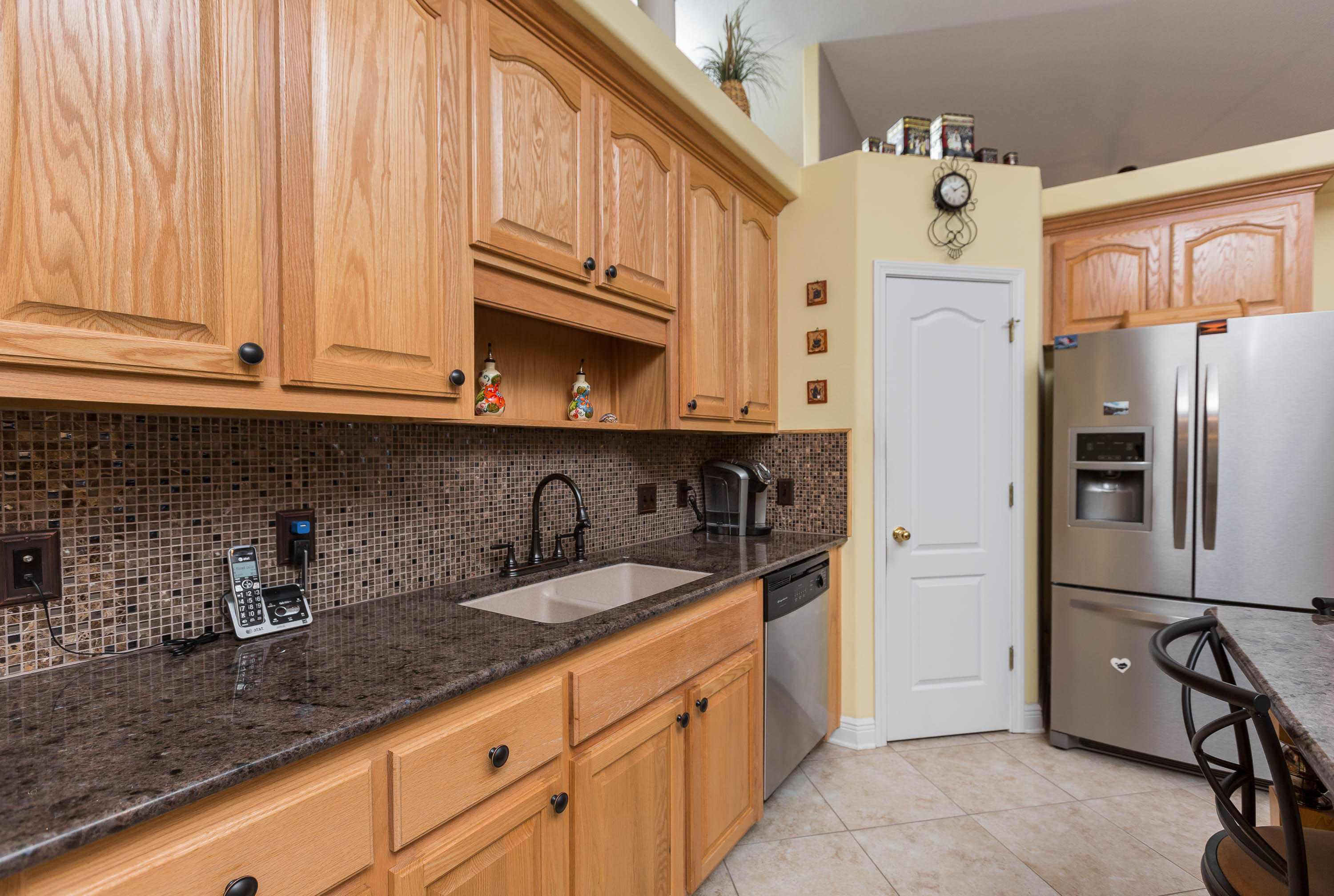 402 Swift Fox Run Crestview, FL 32536 - Photo 31 of 47 a kitchen with stainless steel appliances granite countertop a refrigerator and a sink