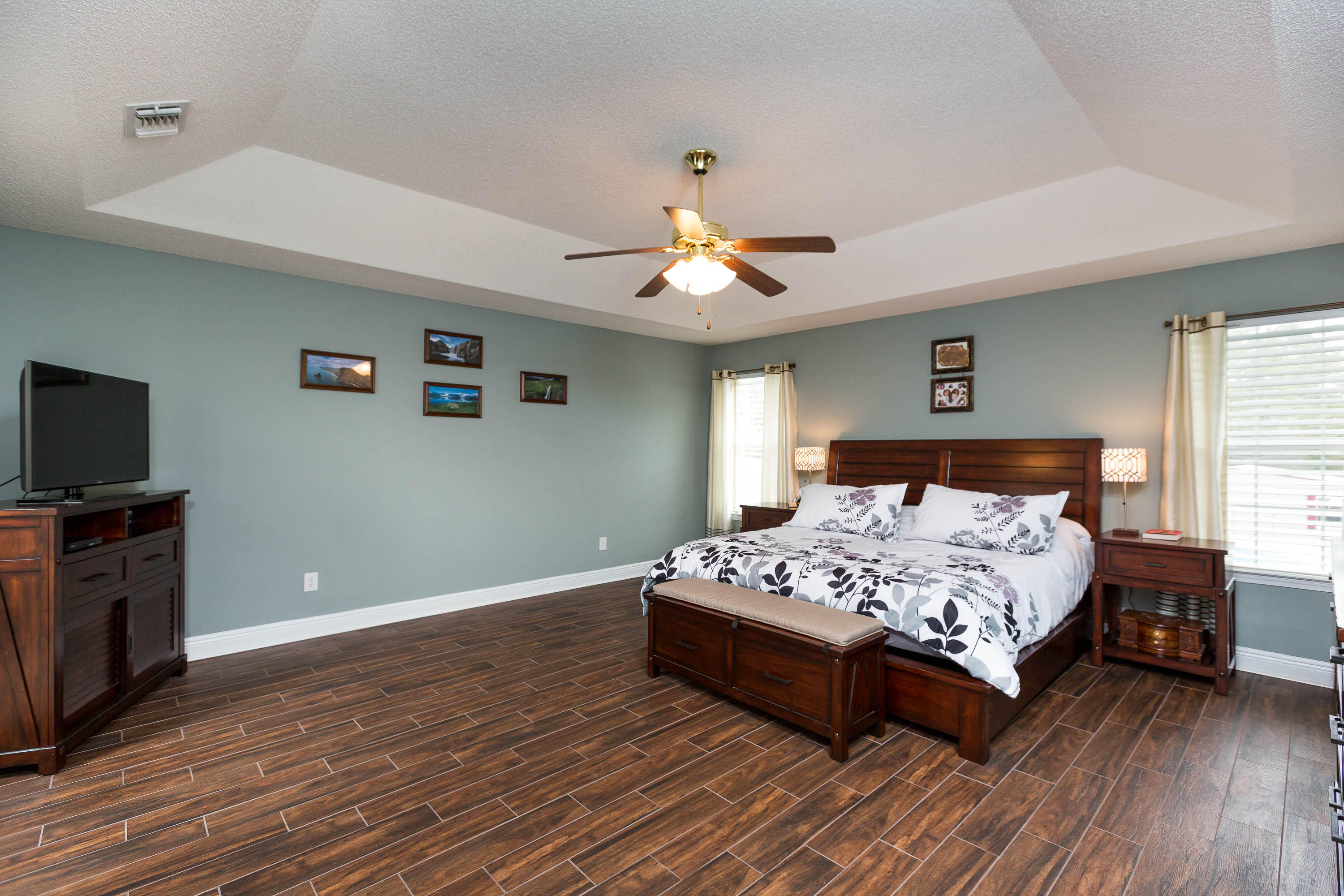 402 Swift Fox Run Crestview, FL 32536 - Photo 32 of 47 a bedroom with a bed and wooden floor