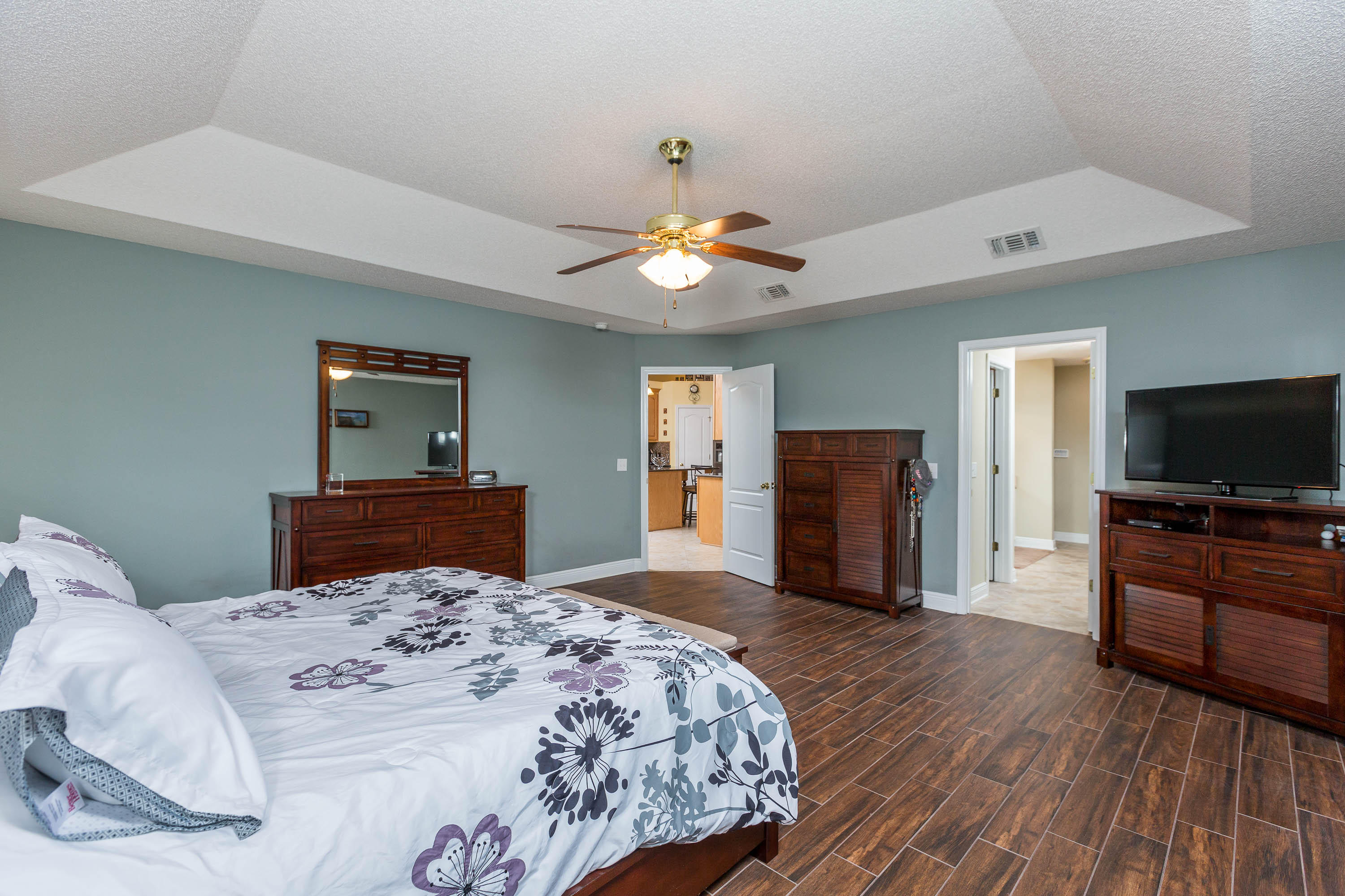 402 Swift Fox Run Crestview, FL 32536 - Photo 33 of 47 a bedroom with a bed and a flat screen tv